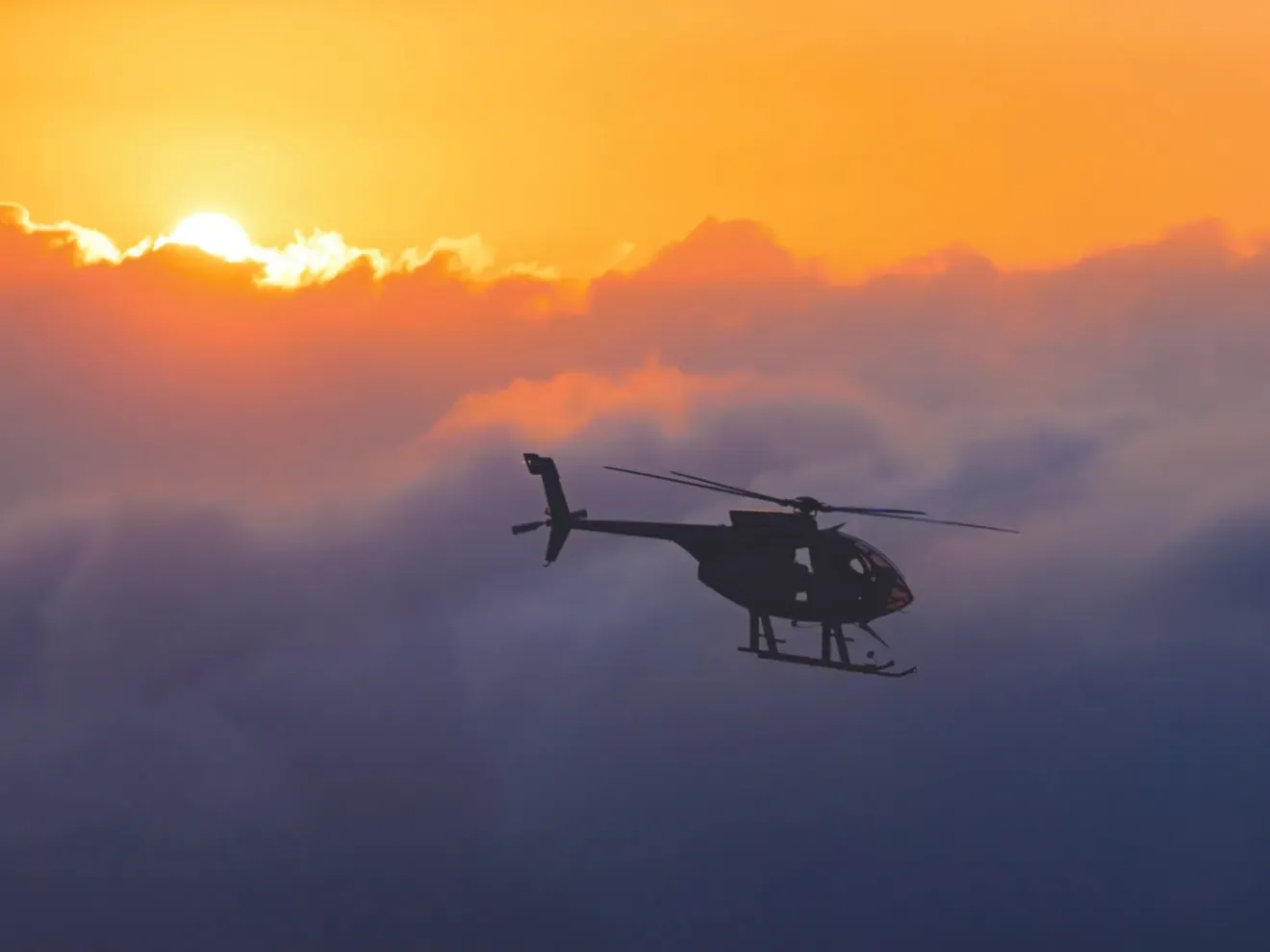 Helicopter flying over Hawaii volcanoes