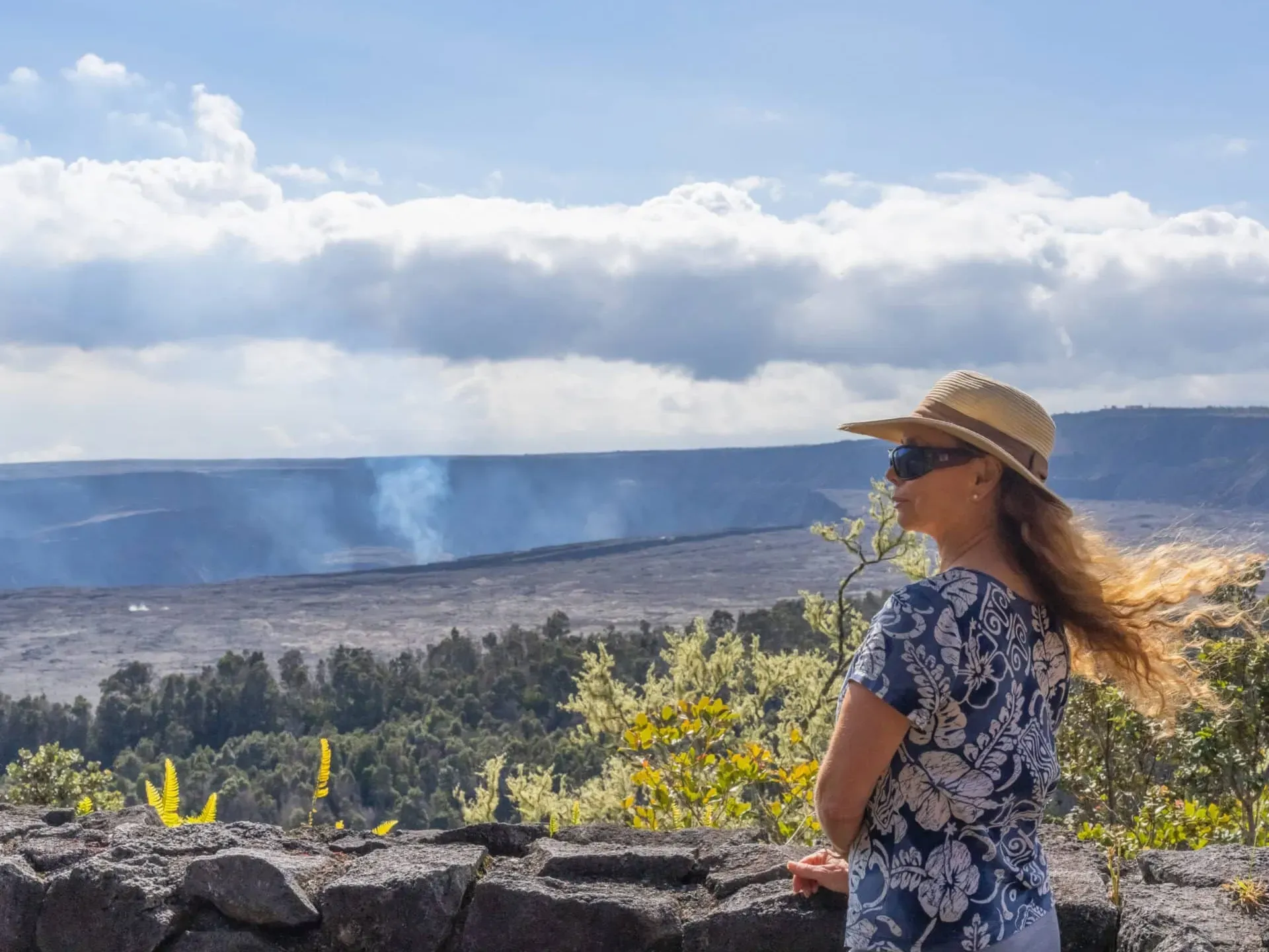 A person standing in front of a volcanic mountain in Hilo